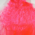 Close-up of bright pink Hedron Big Fly w/Curl Fiber on a white background