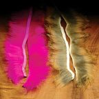 Two Hareline 1/8" Crosscut Rabbit Strips, on a wooden surface.