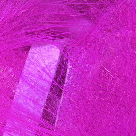 Close-up of bright pink Hareline 1/8" Crosscut Rabbit Strips