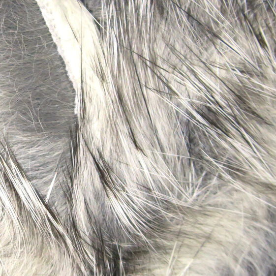 Close-up of gray and black Hareline 1/8" Crosscut Rabbit Strips