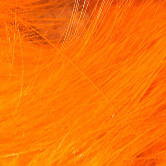 Close-up of bright orange Hareline 1/8" Crosscut Rabbit Strips