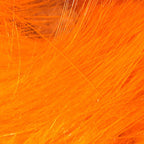 Close-up of bright orange Hareline 1/8" Crosscut Rabbit Strips