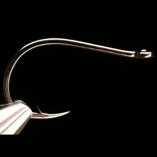 A close-up image of a Daiichi 2582 black nickel finish fishing hook with a round bend and short shank.
