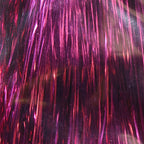 Close-up of pink and red metallic fibers on a dark background