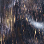 Close-up of a textured surface with gold and silver streaks