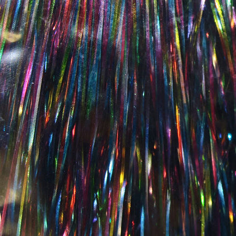 Multicolored tinsel strands on a black background