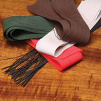 Collection of Hareline Fine Round Legs in various colors on a wooden surface