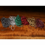 Five spools of Hareline Holographic Braid on a wooden surface.