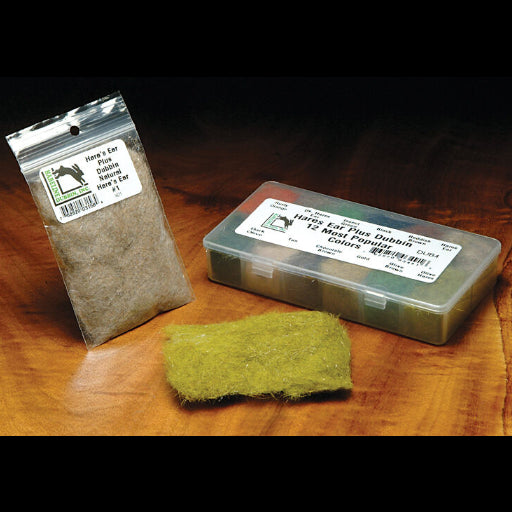 Packaged Hareline Hare's Ear Plus Dubon a wooden surface with labels