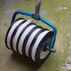 Fishpond Headgate Tippet Holder XL with a blue plastic clip and anodized aerospace aluminum and stainless steel structure, designed to hold spools for fishing.