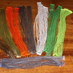 Set of Hareline Grizzly Micro Silicone Legs on a wooden surface