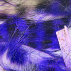 Close-up of blue and white feathers Hareline Tiger Barred 1/8” Rabbit Strips