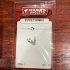 A small stainless steel tippet ring by Scientific Anglers, packaged in a clear plastic blister pack with a red and white branding card.