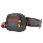 A Fishpond Switchback Belt System 2.0 with various pockets and straps, featuring a wader belt and a shoulder strap, in green, gray, and orange colors.