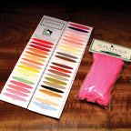 Color swatch book and pink foam on a wooden surface with McFlyfoam branding.