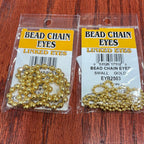 Packaged bead chain eyes for fly tying, available in gold and silver colors, displayed on a fly tying kit card.