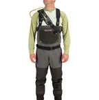 Person wearing a gray and black wader with a backpack on a white background