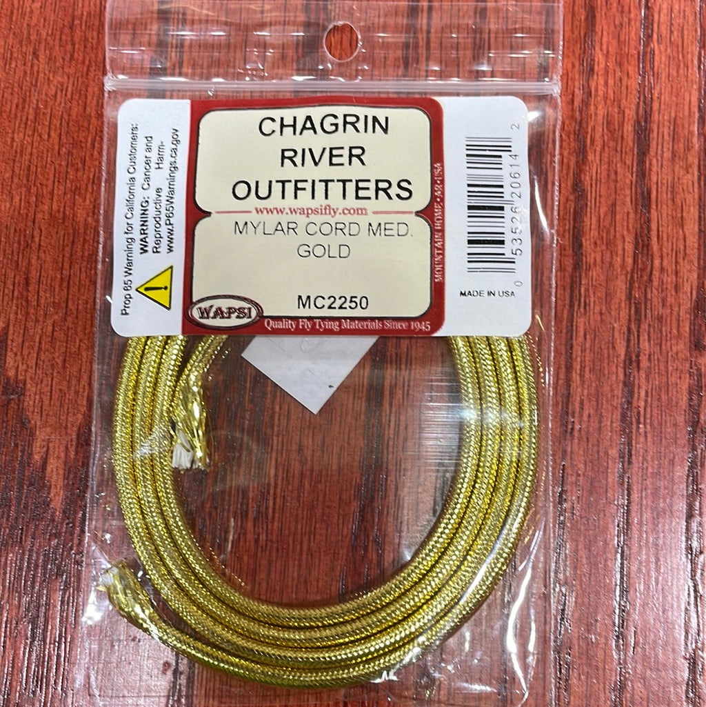 Packaged Wapsi Mylar Cord in gold color, intended for use in fly tying, with Chagrin River Outfitters branding visible.