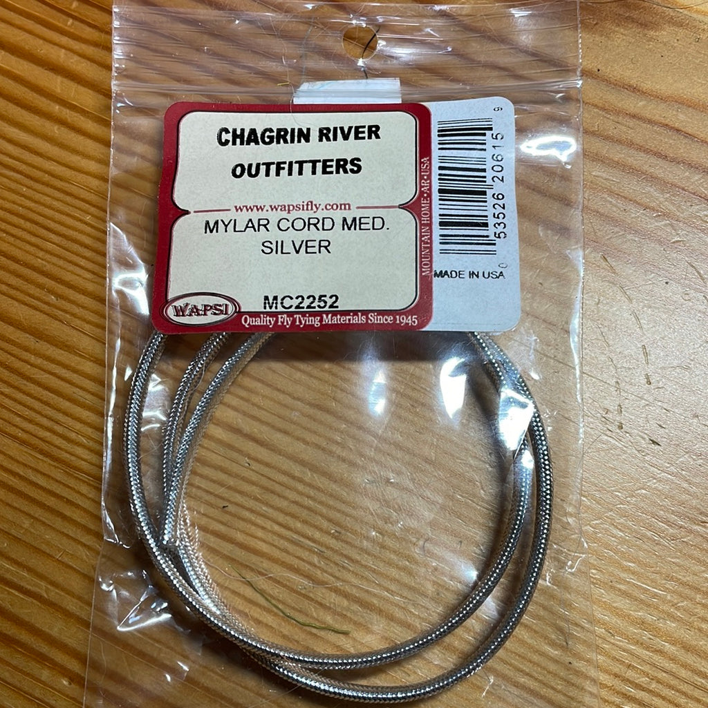 Packaged Wapsi Mylar Cord in silver color, intended for use in fly tying, with Chagrin River Outfitters branding visible.