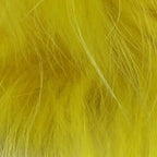 Close-up of bright yellow Hareline Finn Raccoon Zonker