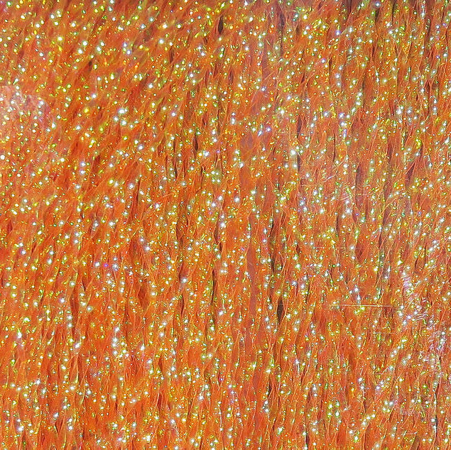 Close-up of orange Hareline Krystal Flash
