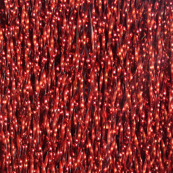 Close-up of red Hareline Krystal Flash