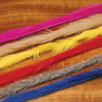 Colorful Hareline Micro Rabbit Strips arranged on a wooden surface