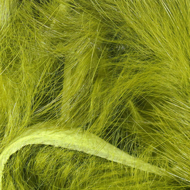 Close-up of bright green Hareline 1/4" Magnum Rabbit Strips