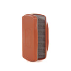A brown waterproof Fishpond Tacky Pescador Medium fly fishing box made of recycled plastic, designed to hold up to 210 flies, with a Flypond logo on the front.