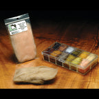 Packaged Hareline Super Fine Dry Fly Dubbing on a wooden surface.