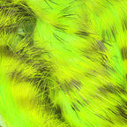 Close-up of bright green Hareline Tiger Barred 1/4" Magnum Rabbit Strips