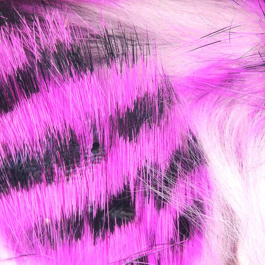 Close-up of pink and black Hareline Tiger Barred 1/4" Magnum Rabbit Strips