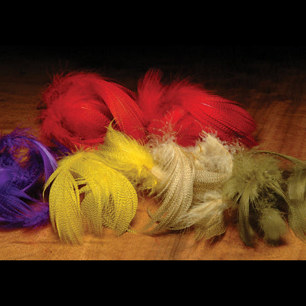 Colorful Hareline Mallard Flank feathers on a wooden surface