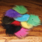 Colorful fox tail hair on a wooden surface